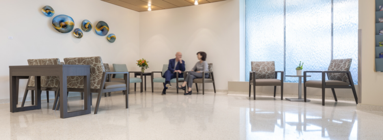 two people sitting in a reception area