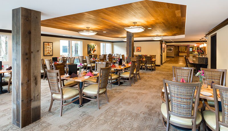 dining area with wood ceiling and groups of tables and chairs