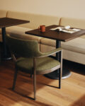 pamplona chair with green fabric in cafe setting