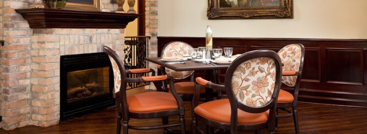dining table by brick fireplace